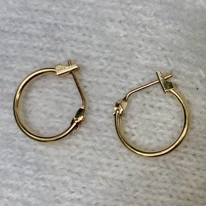 14 K gold stamped petite hoop earrings.